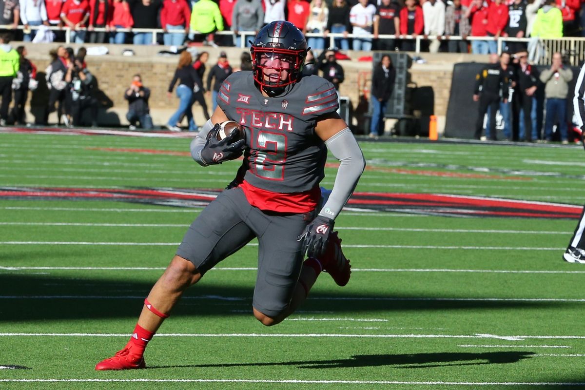 Nov 9, 2024; Lubbock, Texas, USA; Texas Tech Red Raiders tight end Jalin Conyers (12) rushes for a touchdown against the Colorado Buffalos in the first half at Jones AT&T Stadium and Cody Campbell Field. Mandatory Credit: Michael C. Johnson-Imagn Images