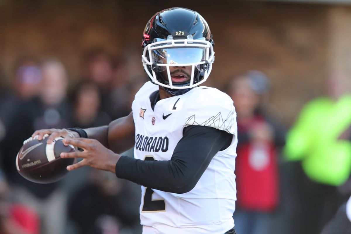 Nov 9, 2024; Lubbock, Texas, USA; Colorado Buffalos quarterback Shedeur Sanders (2) passes against the Texas Tech Red Raiders in the first half at Jones AT&T Stadium and Cody Campbell Field. Mandatory Credit: Michael C. Johnson-Imagn Images