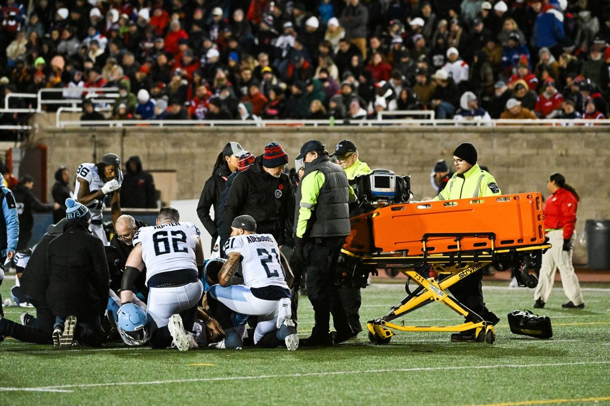 Nov 9, 2024; Montreal, Quebec, CAN; Toronto Argonauts quarterback Chad Kelly (12) gets escorted out of the field on a gurney against the Montreal Alouettes during the third quarter at Percival-Molson Memorial Stadium. Mandatory Credit: David Kirouac-Imagn Images