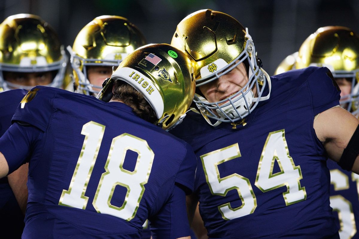 Notre Dame quarterback Steve Angeli (18) knocks helmets with offensive lineman Anthonie Knapp (54) before a NCAA college football game against Florida State at Notre Dame Stadium on Saturday, Nov. 9, 2024, in South Bend.
