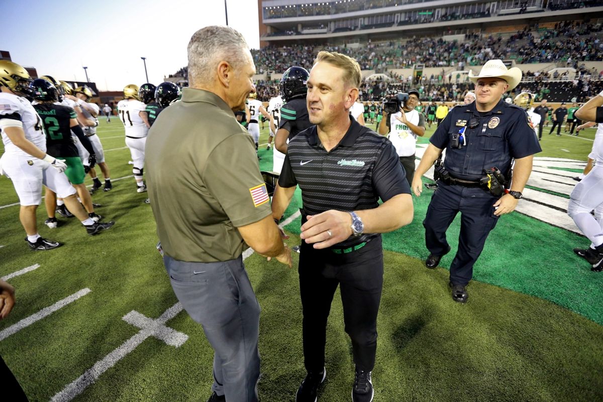 Nov 9, 2024; Denton, Texas, USA; North Texas Mean Green head coach Eric Morris greets Army Black Knights head coach Jeff Monken after Army’s 14-3 win during the second half at DATCU Stadium. Mandatory Credit: Danny Wild-Imagn Images