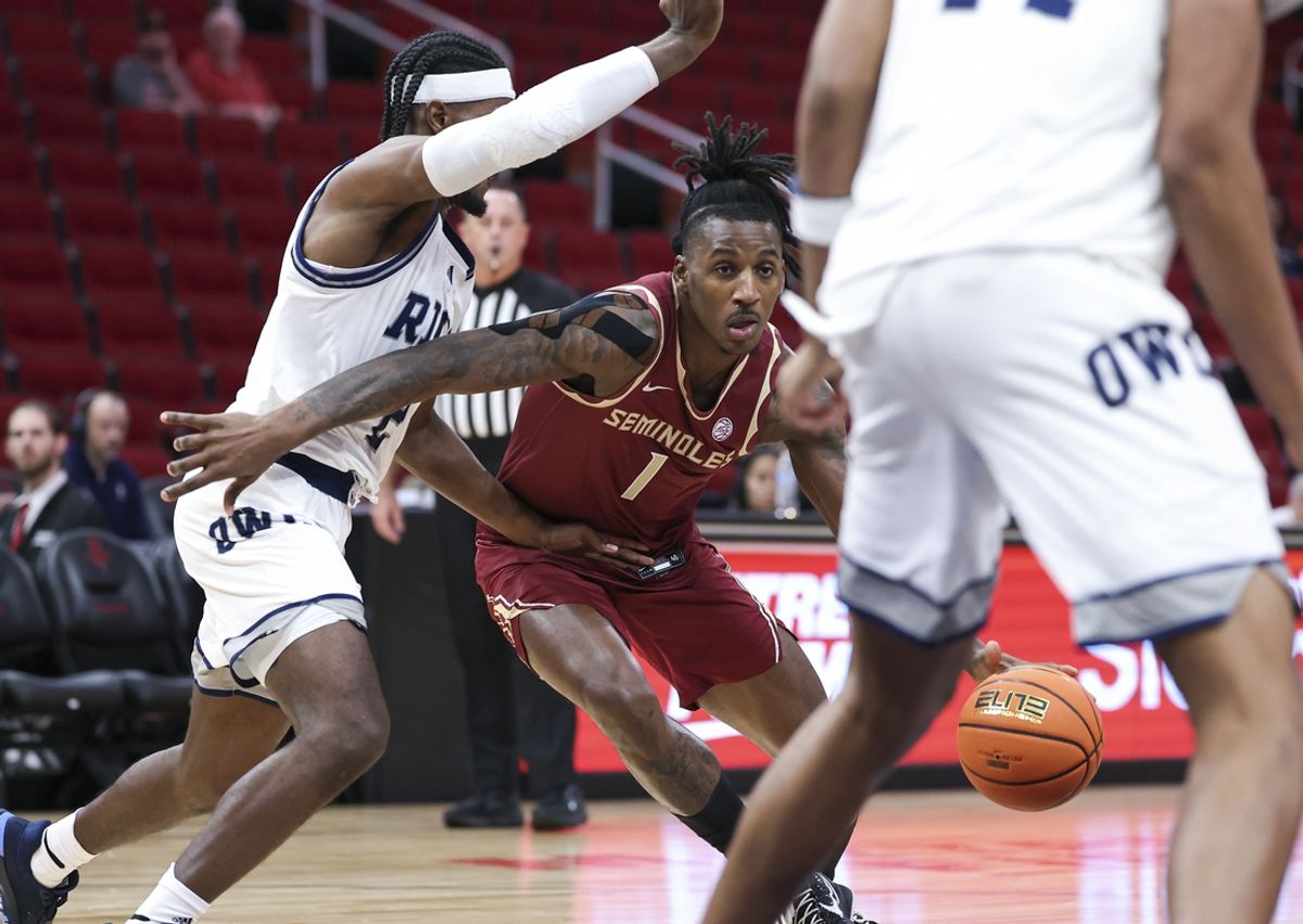 Nov 9, 2024; Houston, Texas, USA; Florida State Seminoles guard Jamir Watkins (1) dribbles the ball as Rice Owls guard Emory Lanier (2) defends during the first half at Toyota Center. Mandatory Credit: Troy Taormina-Imagn Images