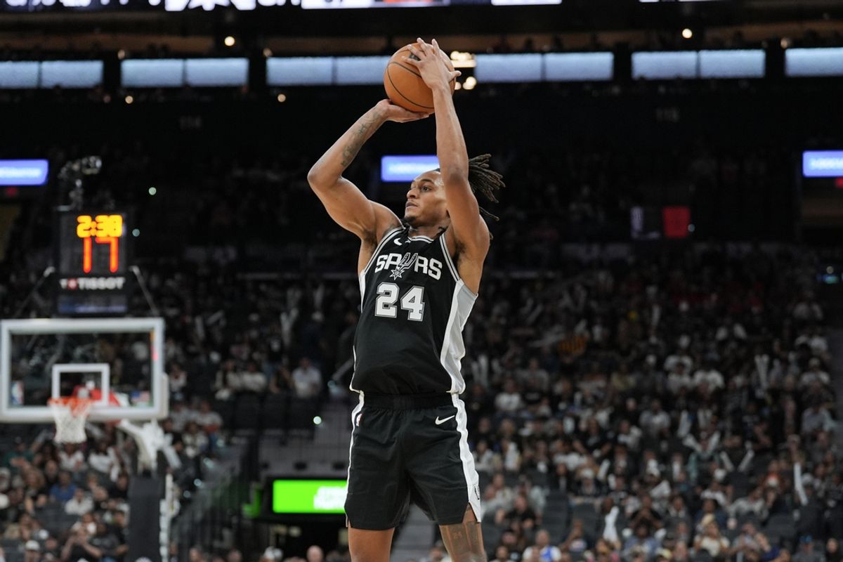 Nov 9, 2024; San Antonio, Texas, USA;  San Antonio Spurs guard Devin Vassell (24) shoots in the second half against the Utah Jazz at Frost Bank Center. Mandatory Credit: Daniel Dunn-Imagn Images