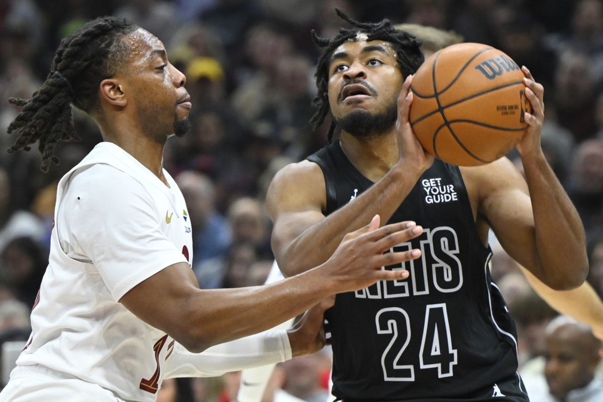 Nov 9, 2024; Cleveland, Ohio, USA; Cleveland Cavaliers guard Darius Garland (10) defends Brooklyn Nets guard Cam Thomas (24) in the first quarter at Rocket Mortgage FieldHouse. Mandatory Credit: David Richard-Imagn Images
