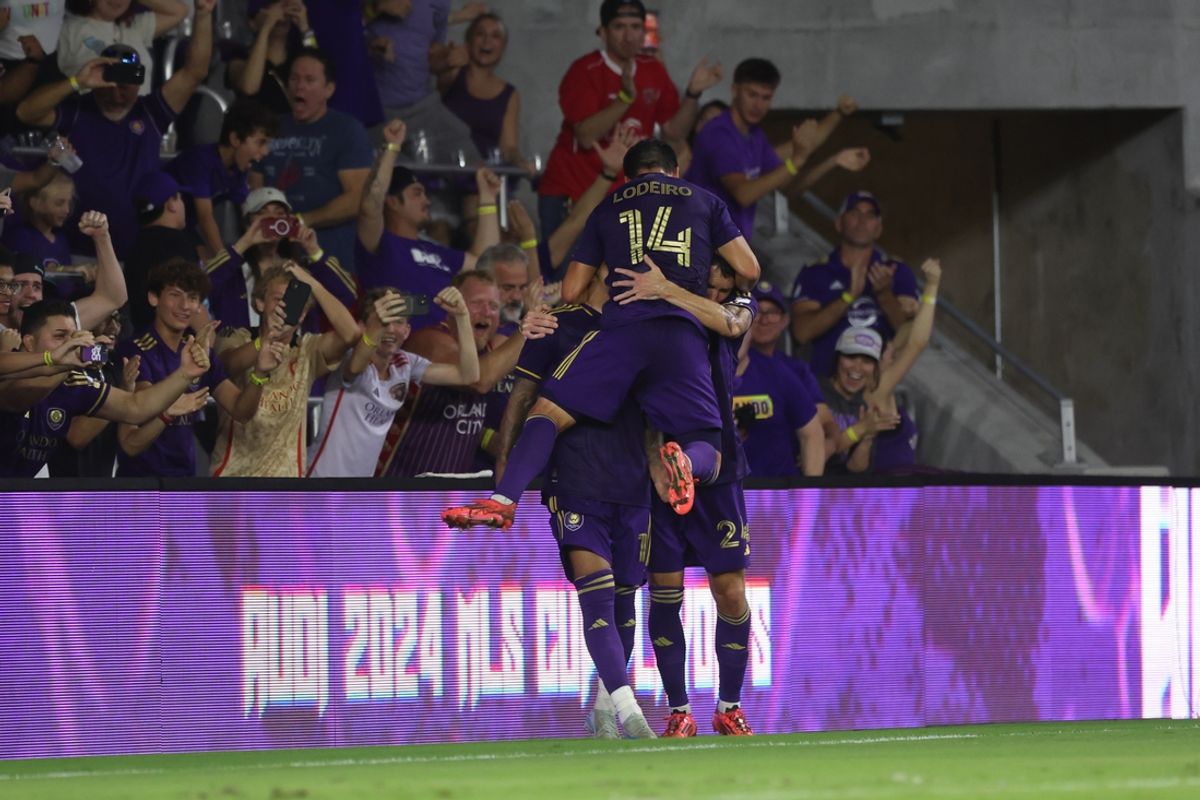 Nov 9, 2024; Orlando, Florida, USA; Orlando City forward Facundo Torres (10) celebrates a goal with defender Kyle Smith (24) and midfielder Nicolas Lodeiro (14) in the second half against the Charlotte FC in a 2024 MLS Cup Playoffs Round One match at Inter&Co Stadium. Mandatory Credit: Kim Klement Neitzel-Imagn Images