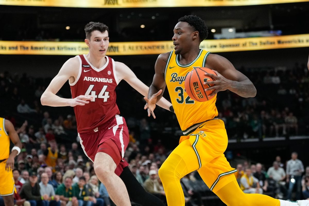 Nov 9, 2024; Dallas, Texas, USA;  Baylor Bears guard Jalen Celestine (32) drives to the basket against Arkansas Razorbacks forward Zvonimir Ivisic (44) during the first half at American Airlines Center. Mandatory Credit: Chris Jones-Imagn Images