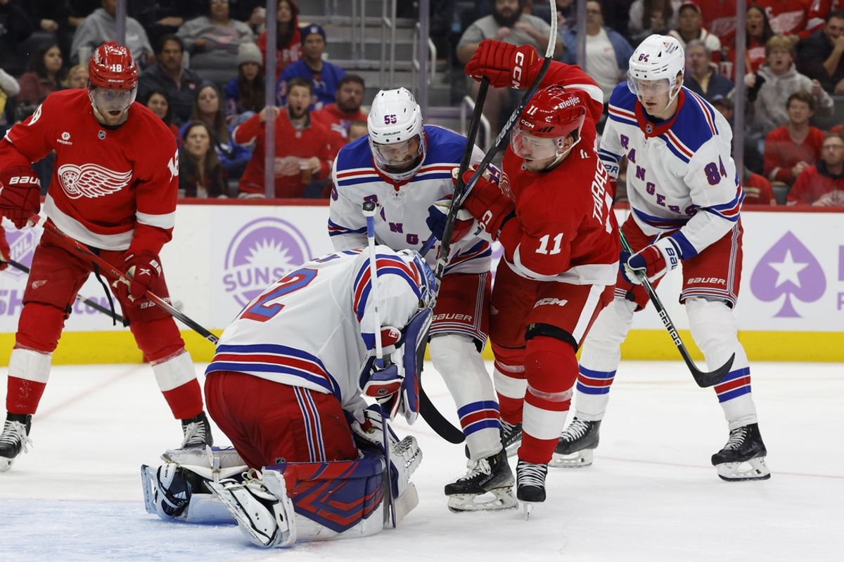 Nov 9, 2024; Detroit, Michigan, USA;  New York Rangers goaltender Jonathan Quick (32) makes a save against Detroit Red Wings right wing Vladimir Tarasenko (11) in the second period at Little Caesars Arena. Mandatory Credit: Rick Osentoski-Imagn Images