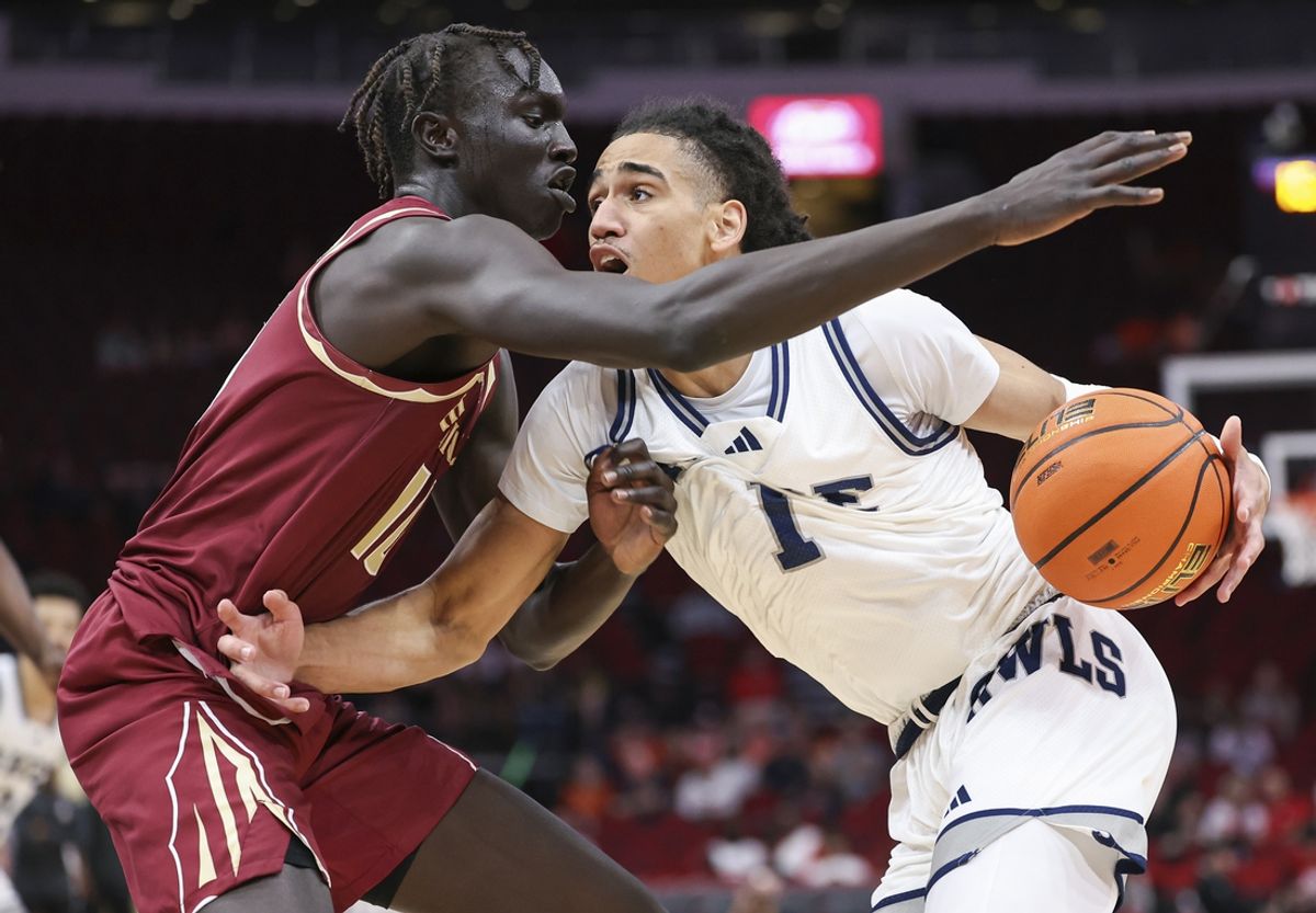 Nov 9, 2024; Houston, Texas, USA; Rice Owls guard Kellen Amos (1) drives with the ball as Florida State Seminoles forward Taylor Bol Bowen (10) defends during the second half at Toyota Center. Mandatory Credit: Troy Taormina-Imagn Images