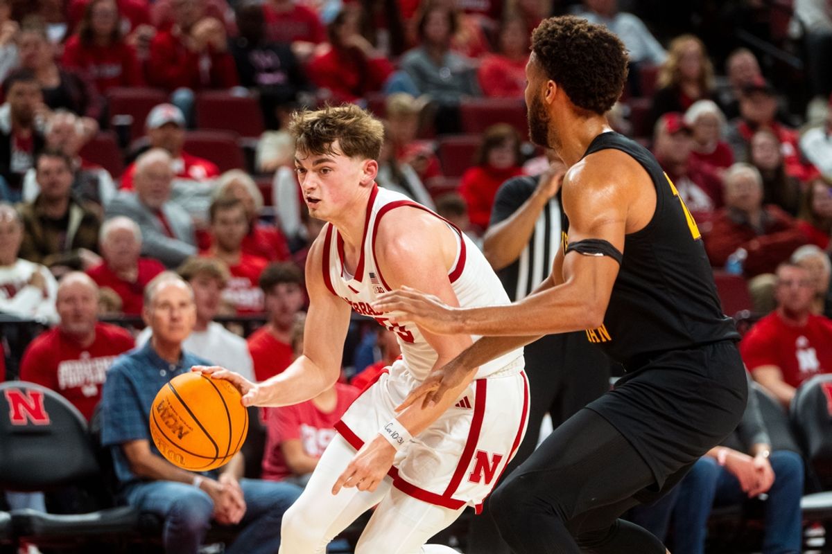 Nov 9, 2024; Lincoln, Nebraska, USA; Nebraska Cornhuskers guard Connor Essegian (0) drives against Bethune-Cookman Wildcats forward Daniel Rouzan (23) during the first half at Pinnacle Bank Arena. Mandatory Credit: Dylan Widger-Imagn Images