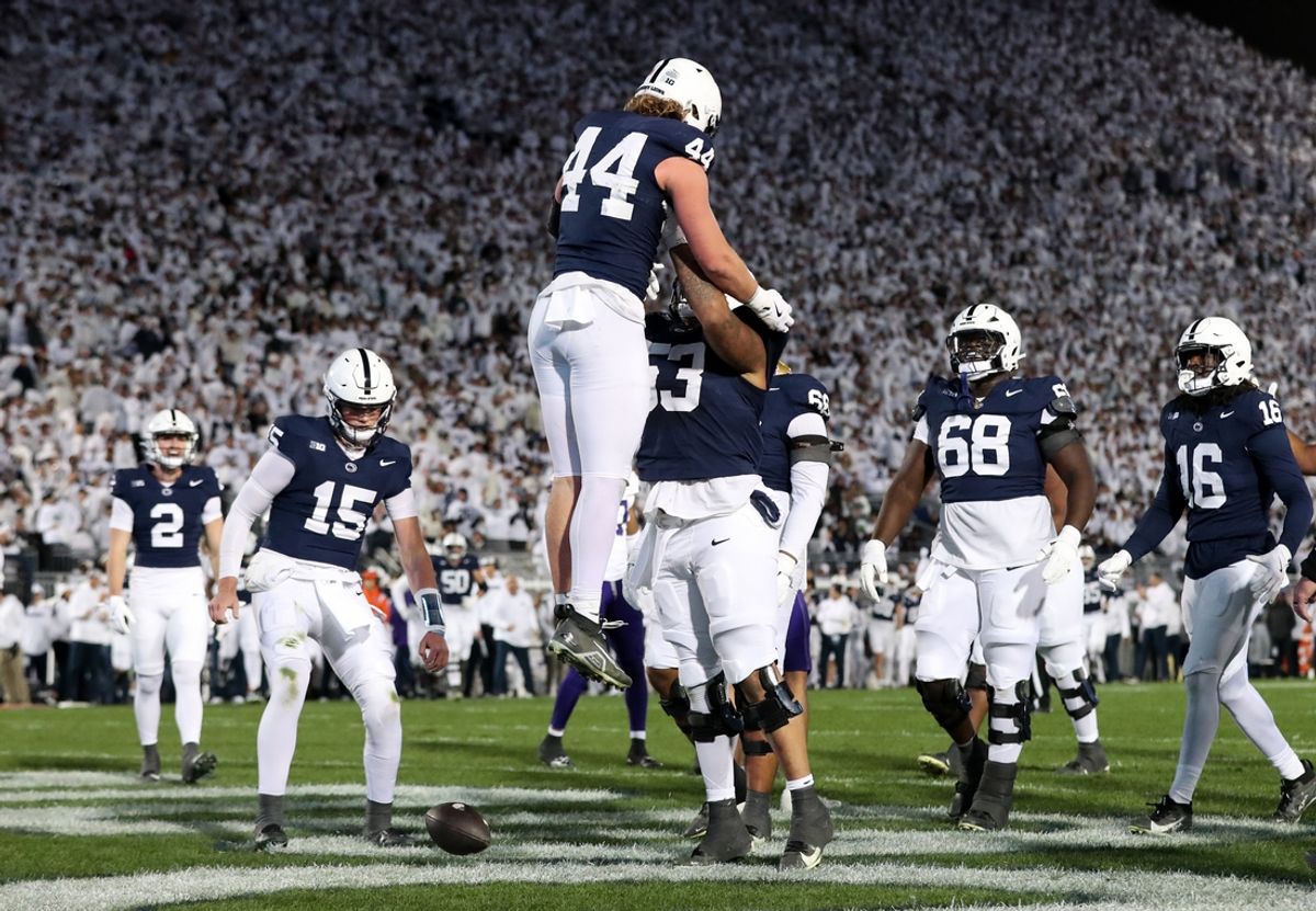 Nov 9, 2024; University Park, Pennsylvania, USA; Penn State Nittany Lions tight end Tyler Warren (44) is lifted into the air by offensive lineman Nick Dawkins (53) after scoring a touchdown against the Washington Huskies during the second quarter at Beaver Stadium. Mandatory Credit: Matthew O'Haren-Imagn Images