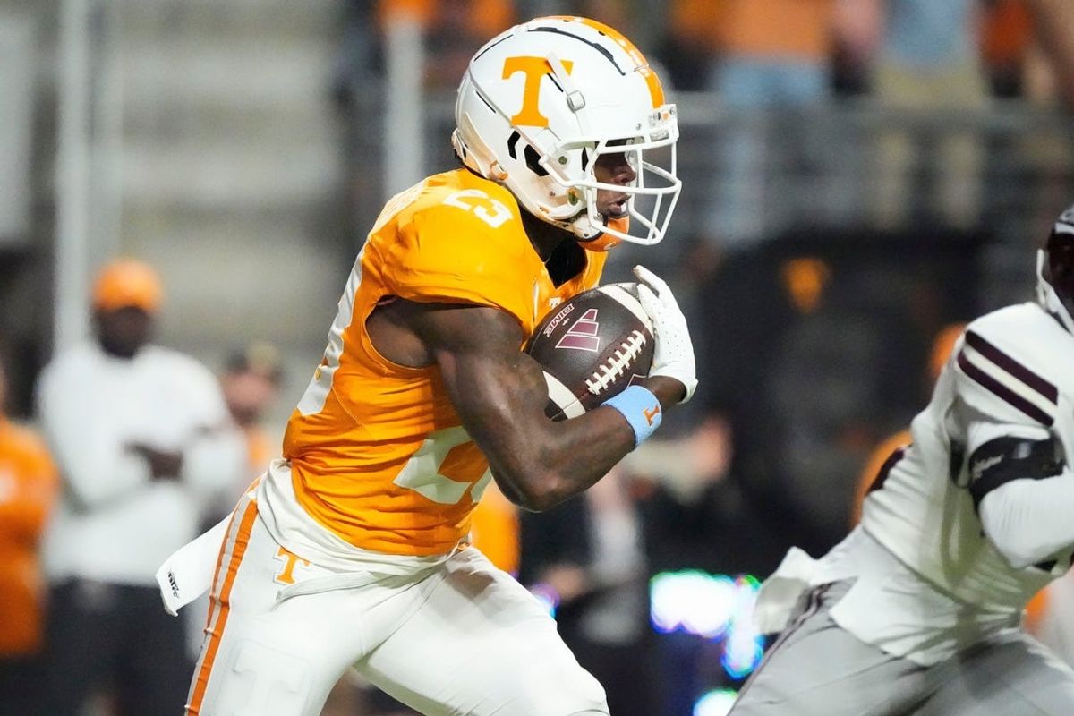 Nov 9, 2024; Knoxville, Tennessee, USA; Tennessee Volunteers defensive back Boo Carter (23) runs with the ball against the Mississippi State Bulldogs during the first half at Neyland Stadium. Mandatory Credit: Saul Young/USA TODAY Network via Imagn Images