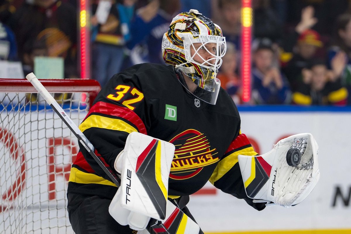 Nov 9, 2024; Vancouver, British Columbia, CAN; Vancouver Canucks goalie Kevin Lankinen (32) makes a save during warm up prior to a game against the Edmonton Oilers at Rogers Arena. Mandatory Credit: Bob Frid-Imagn Images