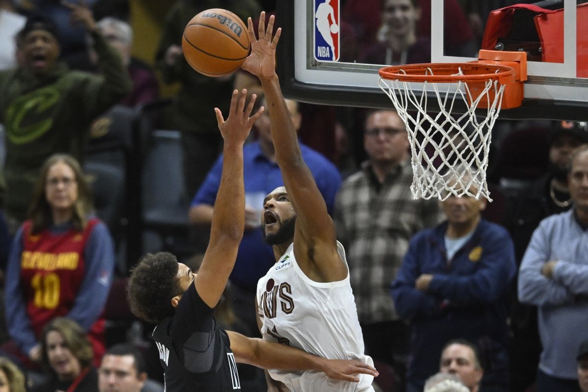 Nov 9, 2024; Cleveland, Ohio, USA; Cleveland Cavaliers forward Evan Mobley (4) blocks a shot by Brooklyn Nets forward Cameron Johnson (2) in the fourth quarter at Rocket Mortgage FieldHouse. Mandatory Credit: David Richard-Imagn Images
