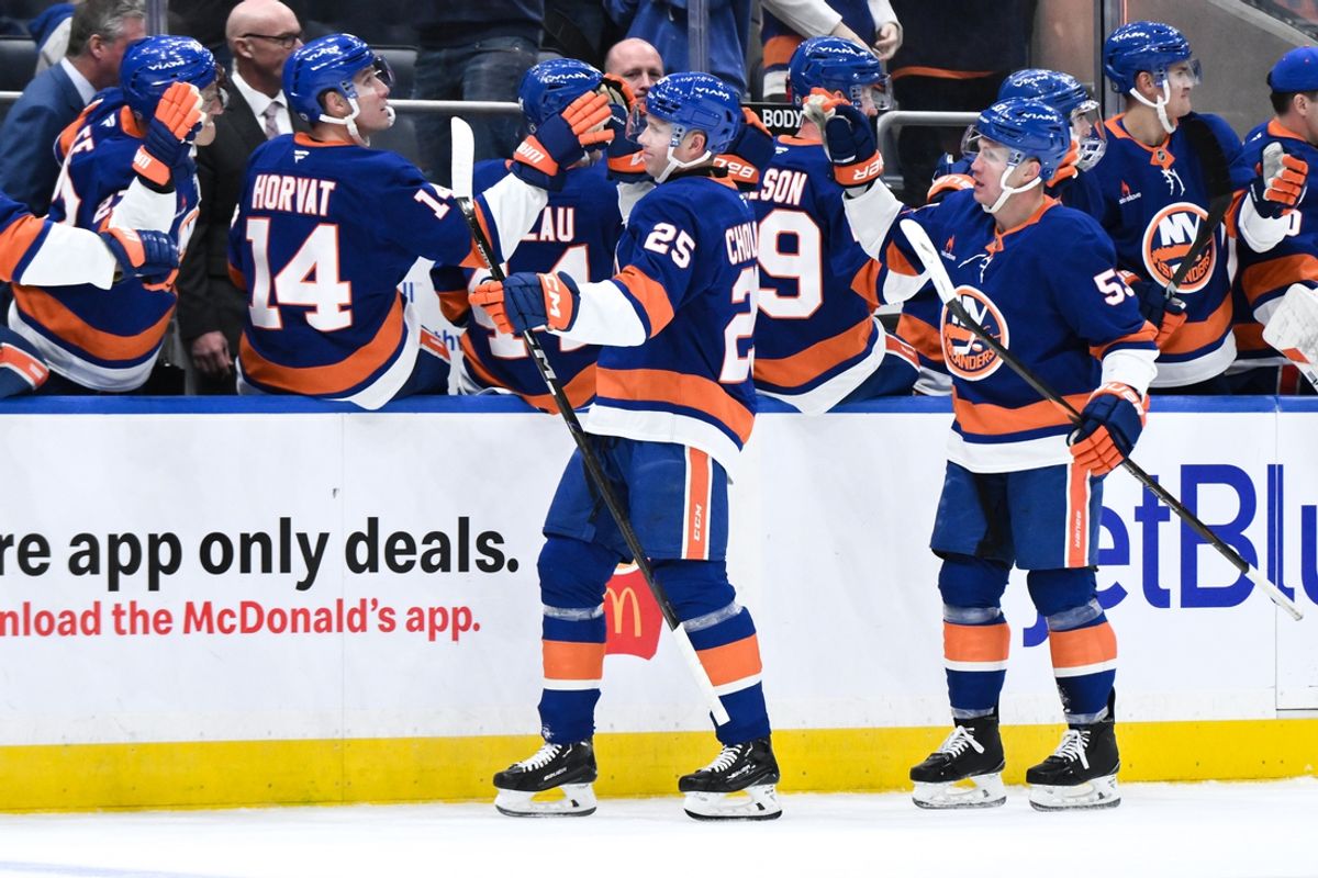 Nov 9, 2024; Elmont, New York, USA; New York Islanders defenseman Dennis Cholowski (25) celebrates with teammates after scoring a goal against the New Jersey Devils during the third period at UBS Arena. Mandatory Credit: John Jones-Imagn Images