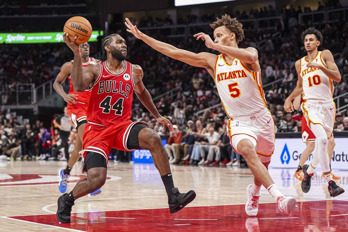 Nov 9, 2024; Atlanta, Georgia, USA; Chicago Bulls forward Patrick Williams (44) drives to the basket against Atlanta Hawks guard Dyson Daniels (5) during the second half at State Farm Arena. Mandatory Credit: Dale Zanine-Imagn Images