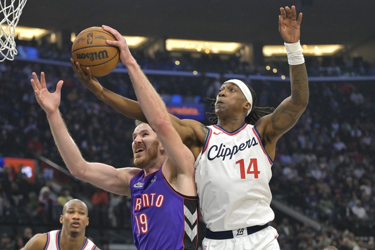 Nov 9, 2024; Inglewood, California, USA; Toronto Raptors center Jakob Poeltl (19) and Los Angeles Clippers guard Terance Mann (14) reach for a rebound in the first half at Intuit Dome. Mandatory Credit: Jayne Kamin-Oncea-Imagn Images