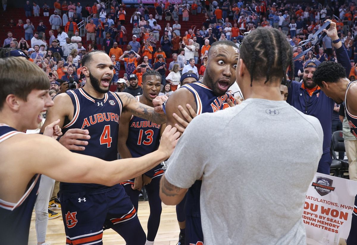Nov 9, 2024; Houston, Texas, USA; Auburn Tigers players celebrate after the game against the Houston Cougars at Toyota Center. Mandatory Credit: Troy Taormina-Imagn Images
