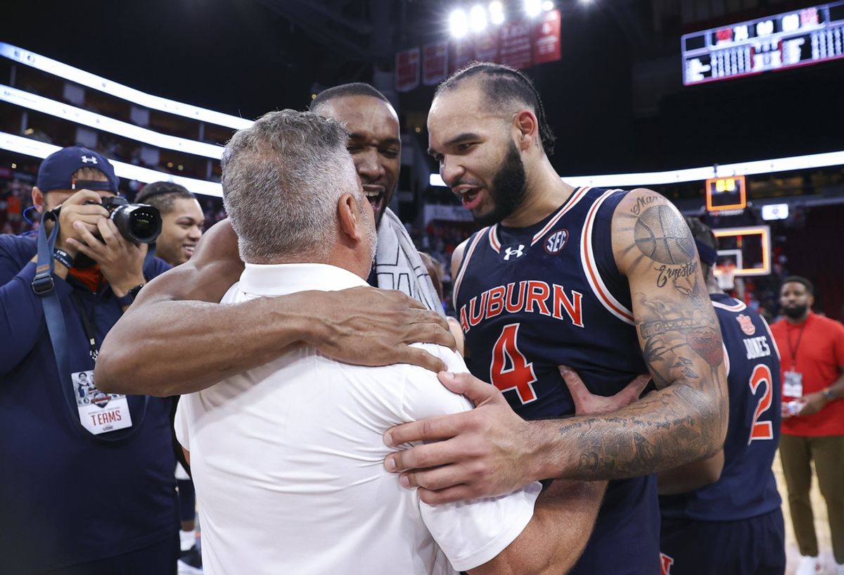 Nov 9, 2024; Houston, Texas, USA; Auburn Tigers forward Johni Broome (4) celebrates with head coach Bruce Pearl after the game against the Houston Cougars at Toyota Center. Mandatory Credit: Troy Taormina-Imagn Images