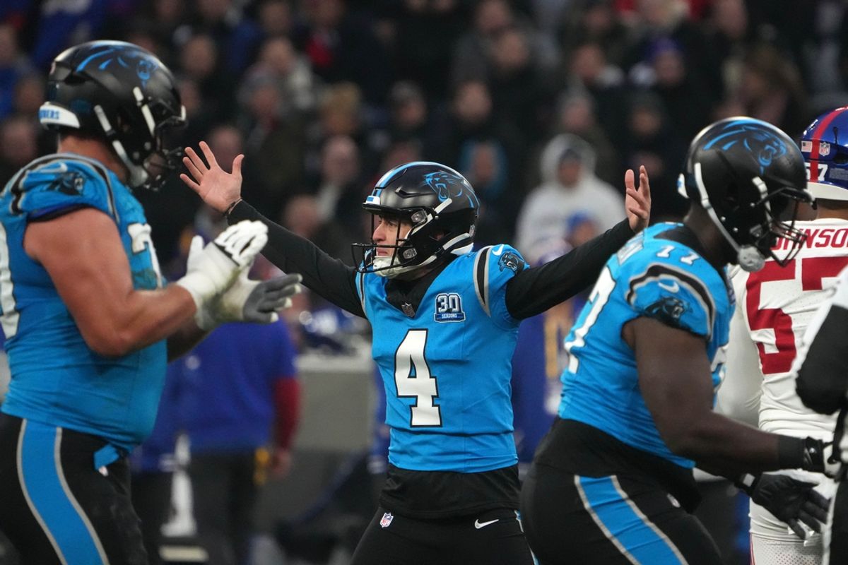 Nov 10, 2024; Munich, Germany; Carolina Panthers place kicker Eddy Pineiro (4) celebrates after kicking a 53-yard field goal against the New York Giants in the first half during the 2024 NFL Munich Game at Allianz Arena. Mandatory Credit: Kirby Lee-Imagn Images