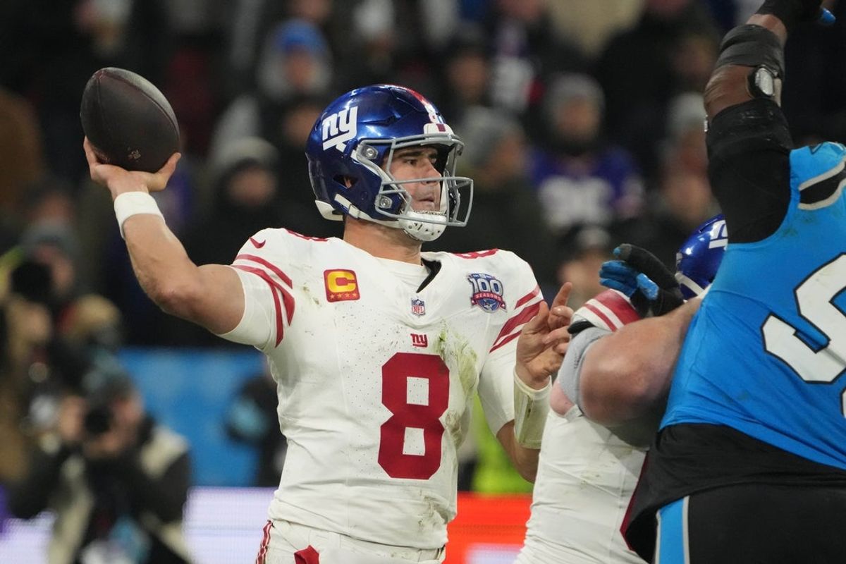 Nov 10, 2024; Munich, Germany; New York Giants quarterback Daniel Jones (8) throws the ball against the Carolina Panthers  in the second half during the 2024 NFL Munich Game at Allianz Arena. Mandatory Credit: Kirby Lee-Imagn Images