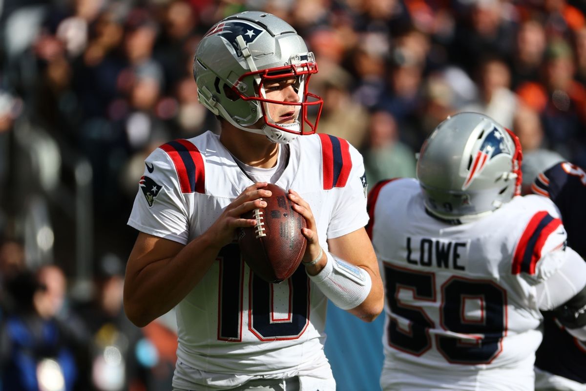 Nov 10, 2024; Chicago, Illinois, USA; New England Patriots quarterback Drake Maye (10) drops back to pass against the Chicago Bears during the first quarter at Soldier Field. Mandatory Credit: Mike Dinovo-Imagn Images