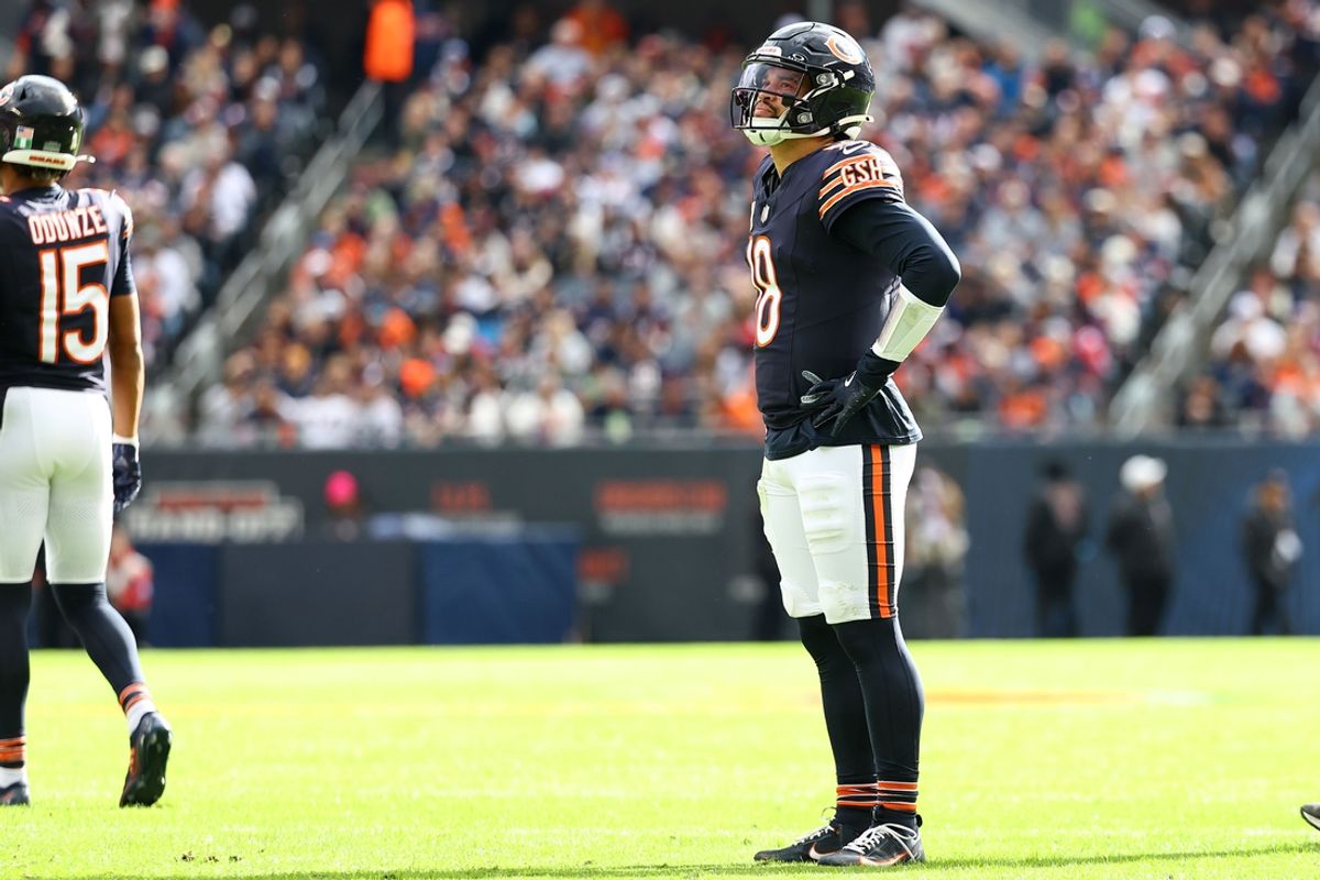 Nov 10, 2024; Chicago, Illinois, USA; Chicago Bears quarterback Caleb Williams (18) reacts against the New England Patriots during the first quarter at Soldier Field. Mandatory Credit: Mike Dinovo-Imagn Images