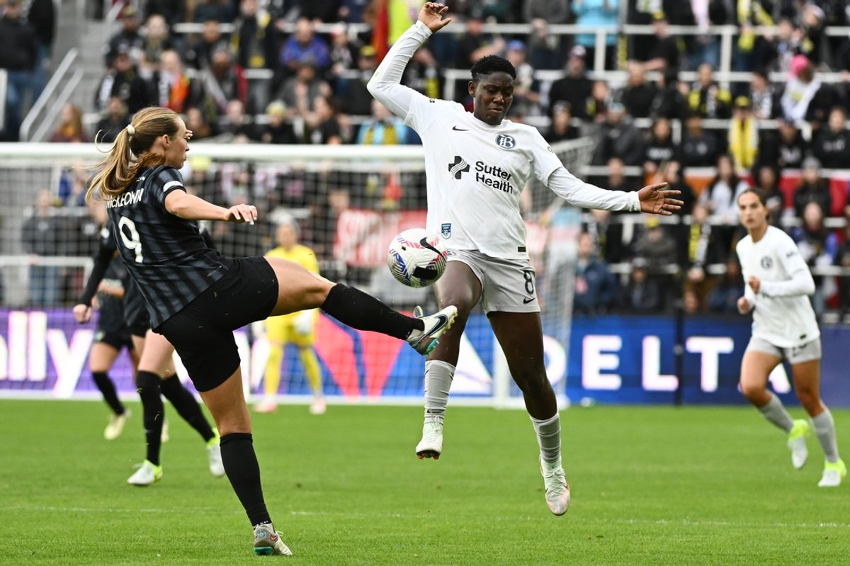 Nov 10, 2024; Washington, District of Columbia, USA; Washington Spirit defender Tara McKeown (9) and Bay FC forward Asisat Oshoala (8) battle for the ball during extra time in a 2024 NWSL Playoffs quarterfinal match at Audi Field. Mandatory Credit: James A. Pittman-Imagn Images