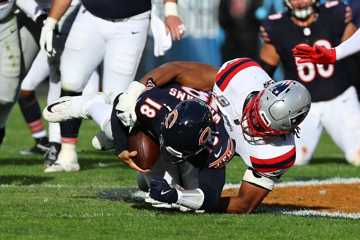Nov 10, 2024; Chicago, Illinois, USA; New England Patriots defensive end Deatrich Wise Jr. (91) sacks Chicago Bears quarterback Caleb Williams (18) during the second half at Soldier Field. Mandatory Credit: Mike Dinovo-Imagn Images