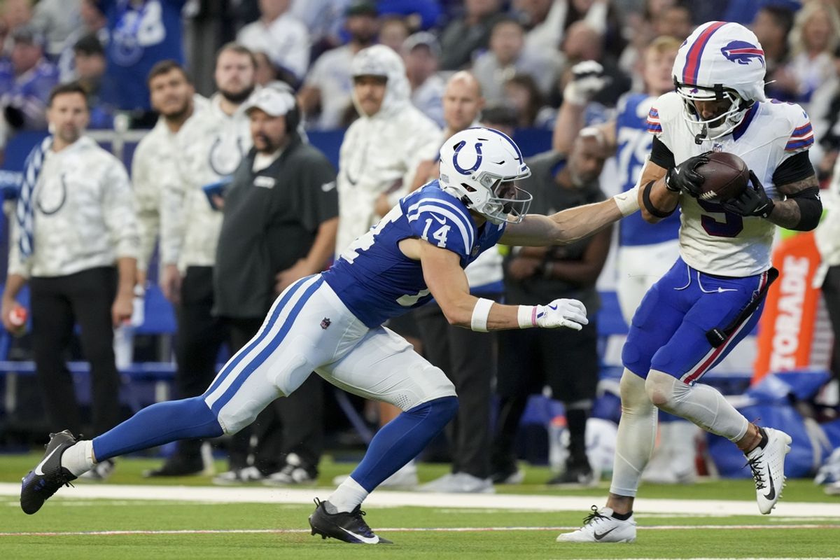 Nov 10, 2024; Indianapolis, Indiana, USA; Buffalo Bills safety Taylor Rapp (9) intercepts a pass in front of Indianapolis Colts wide receiver Alec Pierce (14) on Sunday, Nov. 10, 2024, during a game against the Buffalo Bills at Lucas Oil Stadium in Indianapolis. Mandatory Credit: Grace Smith-USA TODAY Network via Imagn Images