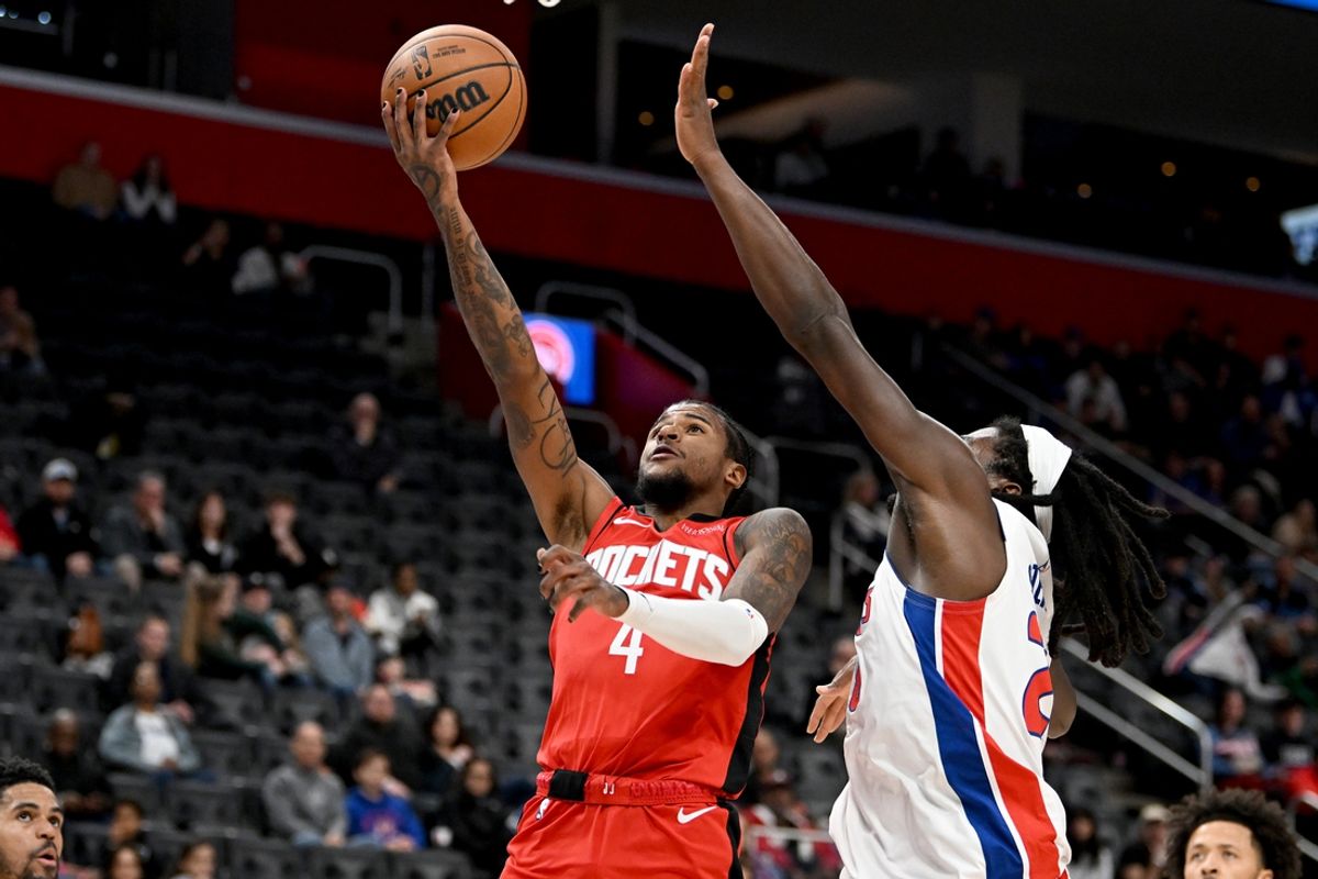 Nov 10, 2024; Detroit, Michigan, USA;  Houston Rockets guard Jalen Green (4) drives to the basket against Detroit Pistons center Isaiah Stewart (28) in the first quarter at Little Caesars Arena. Mandatory Credit: Lon Horwedel-Imagn Images