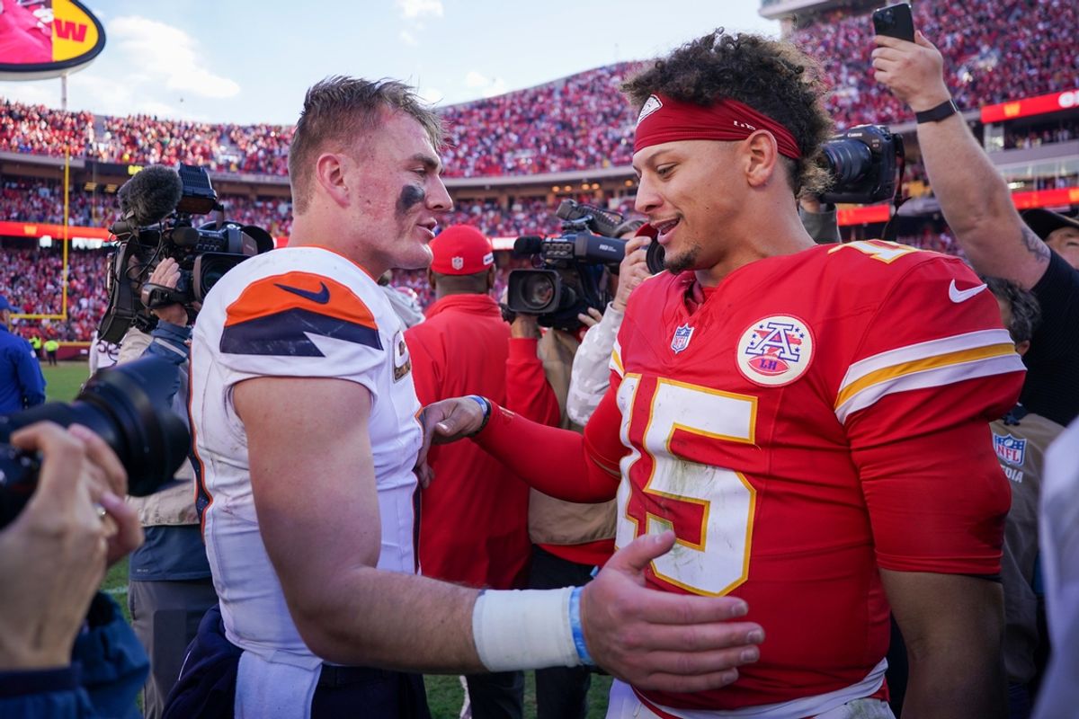 Nov 10, 2024; Kansas City, Missouri, USA; Denver Broncos quarterback Bo Nix (10) talks with Kansas City Chiefs quarterback Patrick Mahomes (15) after the game at GEHA Field at Arrowhead Stadium. Mandatory Credit: Denny Medley-Imagn Images