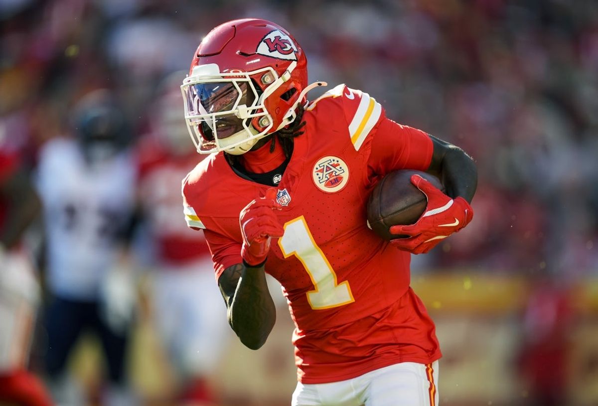 Nov 10, 2024; Kansas City, Missouri, USA; Kansas City Chiefs wide receiver Xavier Worthy (1) runs with the ball during the second half against the Denver Broncos at GEHA Field at Arrowhead Stadium. Mandatory Credit: Jay Biggerstaff-Imagn Images