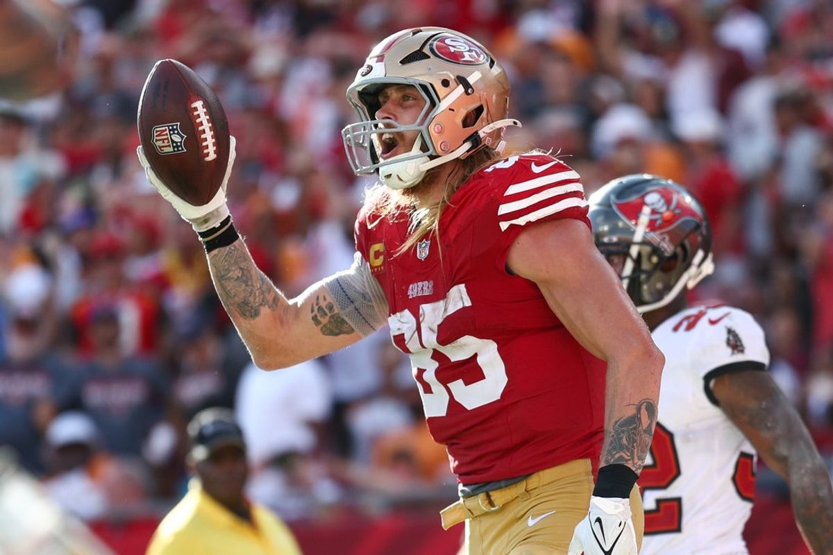 Nov 10, 2024; Tampa, Florida, USA; San Francisco 49ers tight end George Kittle (85) celebrates after scoring a touchdown against the Tampa Bay Buccaneers in the fourth quarter at Raymond James Stadium. Mandatory Credit: Nathan Ray Seebeck-Imagn Images