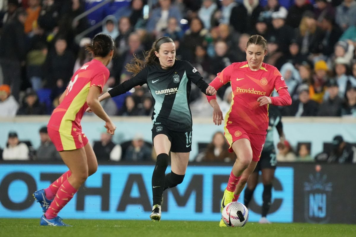 Nov 10, 2024; Harrison, New Jersey, USA; NJ/NY Gotham FC midfielder Rose Lavelle (16) and Portland Thorns FC midfielder Olivia Moultrie (13) battle for the ball in the second half in a 2024 NWSL Playoffs quarterfinal match at Red Bull Arena. Mandatory Credit: Lucas Boland-Imagn Images