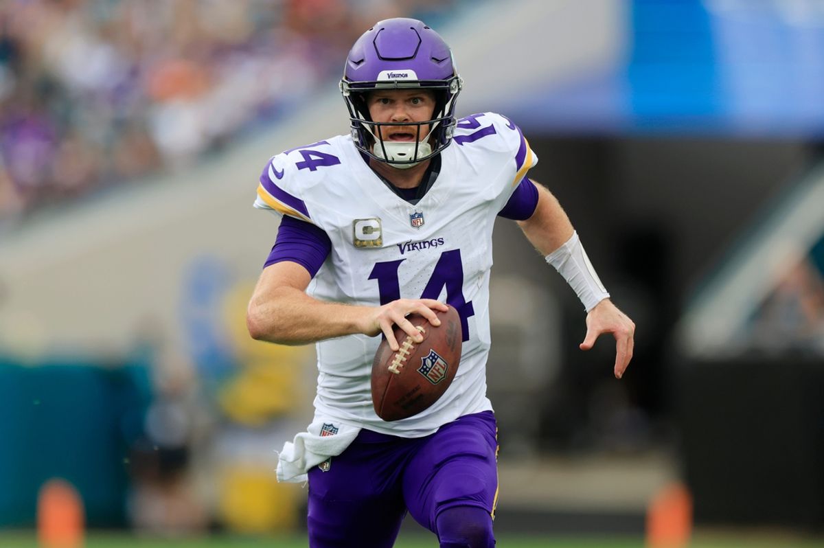 Minnesota Vikings quarterback Sam Darnold (14) is pressured out of the pocket and forced to run during the second quarter an NFL football matchup Sunday, Nov. 10, 2024 at Everbank Stadium in Jacksonville, Fla. The Vikings defeated the Jaguars 12-7. [Corey Perrine/Florida Times-Union]