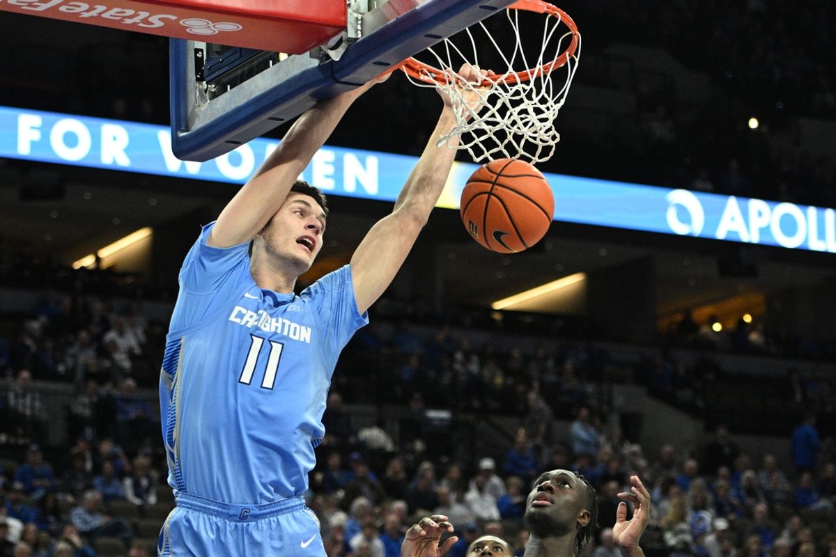Nov 10, 2024; Omaha, Nebraska, USA; Creighton Bluejays center Ryan Kalkbrenner (11) dunks against the Fairleigh Dickinson Knights during the second half at CHI Health Center Omaha. Mandatory Credit: Steven Branscombe-Imagn Images