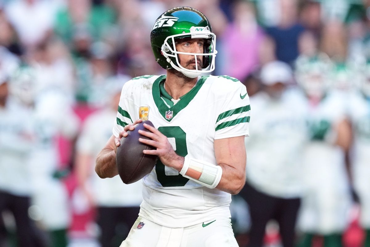 Nov 10, 2024; Glendale, Arizona, USA; New York Jets quarterback Aaron Rodgers (8) passes against the Arizona Cardinals during the second half at State Farm Stadium. Mandatory Credit: Joe Camporeale-Imagn Images