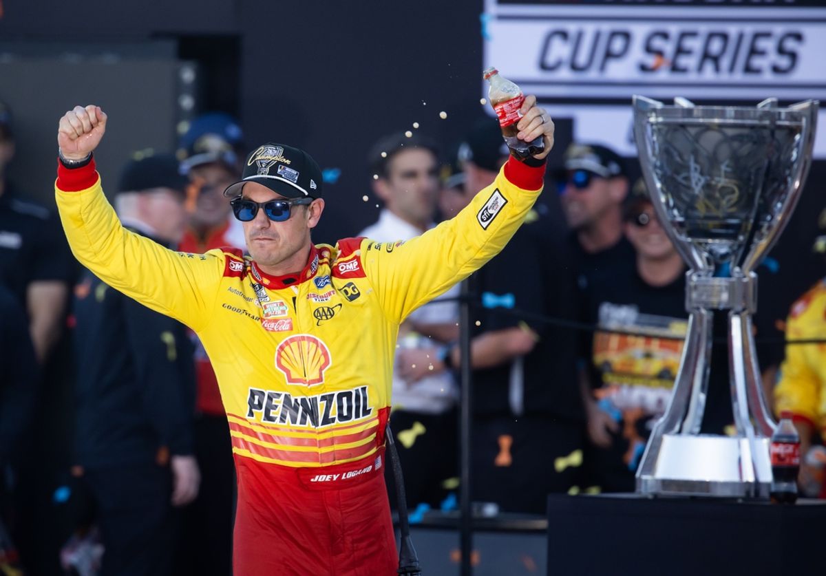 Nov 10, 2024; Avondale, Arizona, USA; NASCAR Cup Series driver Joey Logano (22) celebrates after winning the 2024 NASCAR Cup Series championship and the NASCAR Cup Series Championship race at Phoenix Raceway. Mandatory Credit: Mark J. Rebilas-Imagn Images