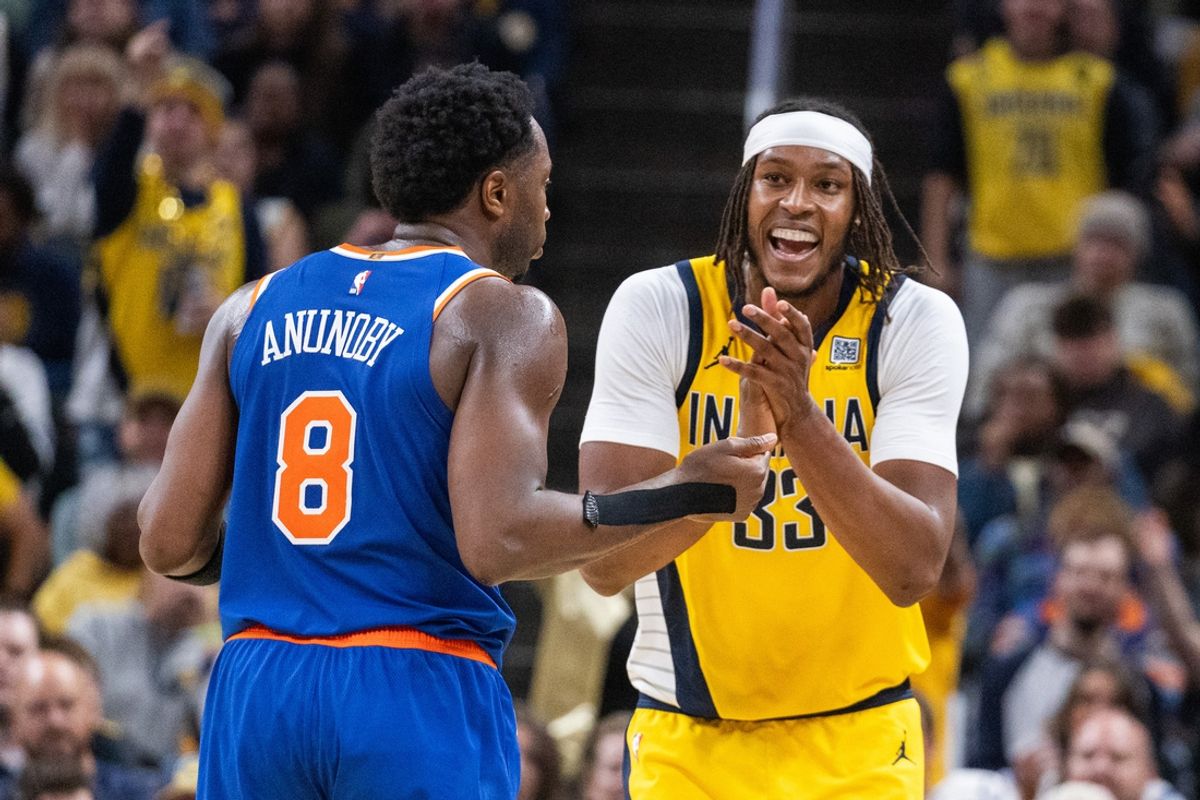 Nov 10, 2024; Indianapolis, Indiana, USA; Indiana Pacers center Myles Turner (33) celebrates a call in front of New York Knicks forward OG Anunoby (8) in the second half at Gainbridge Fieldhouse. Mandatory Credit: Trevor Ruszkowski-Imagn Images