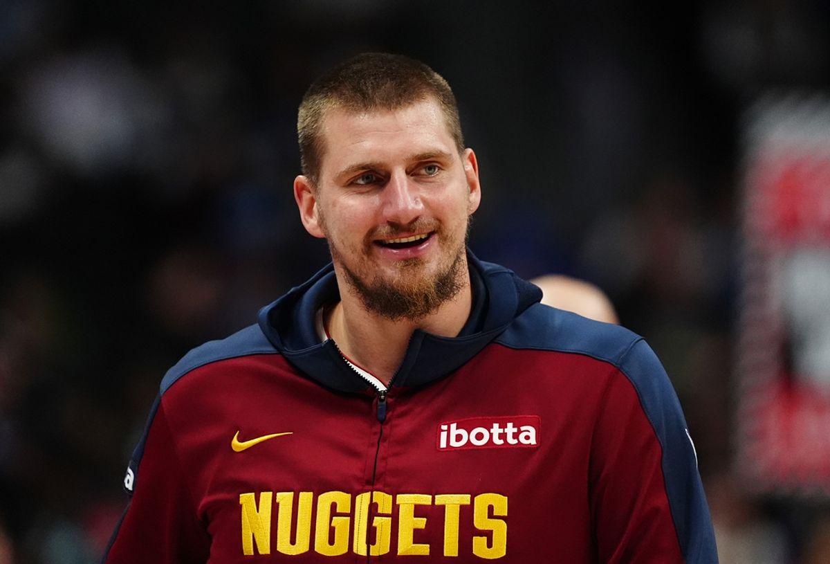 Nov 10, 2024; Denver, Colorado, USA; Denver Nuggets center Nikola Jokic (15) reacts before the game against the Dallas Mavericks at Ball Arena. Mandatory Credit: Ron Chenoy-Imagn Images