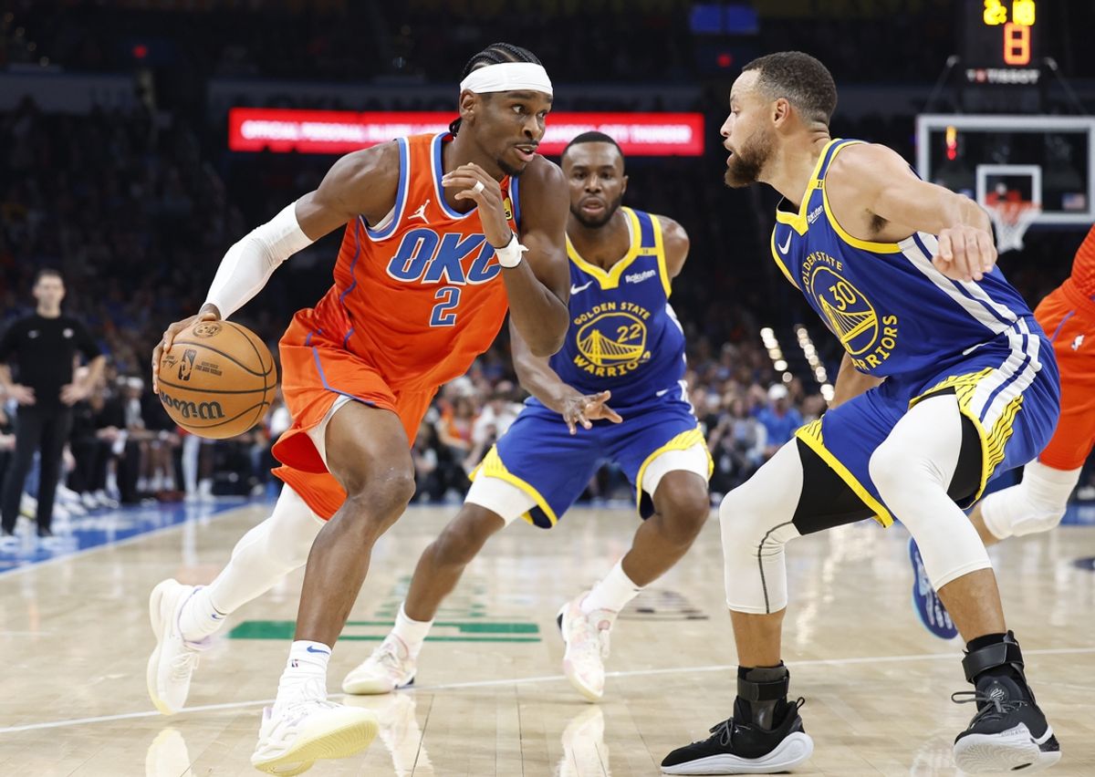 Nov 10, 2024; Oklahoma City, Oklahoma, USA; Oklahoma City Thunder guard Shai Gilgeous-Alexander (2) drives to the basket against Golden State Warriors guard Stephen Curry (30) during the second quarter at Paycom Center. Mandatory Credit: Alonzo Adams-Imagn Images