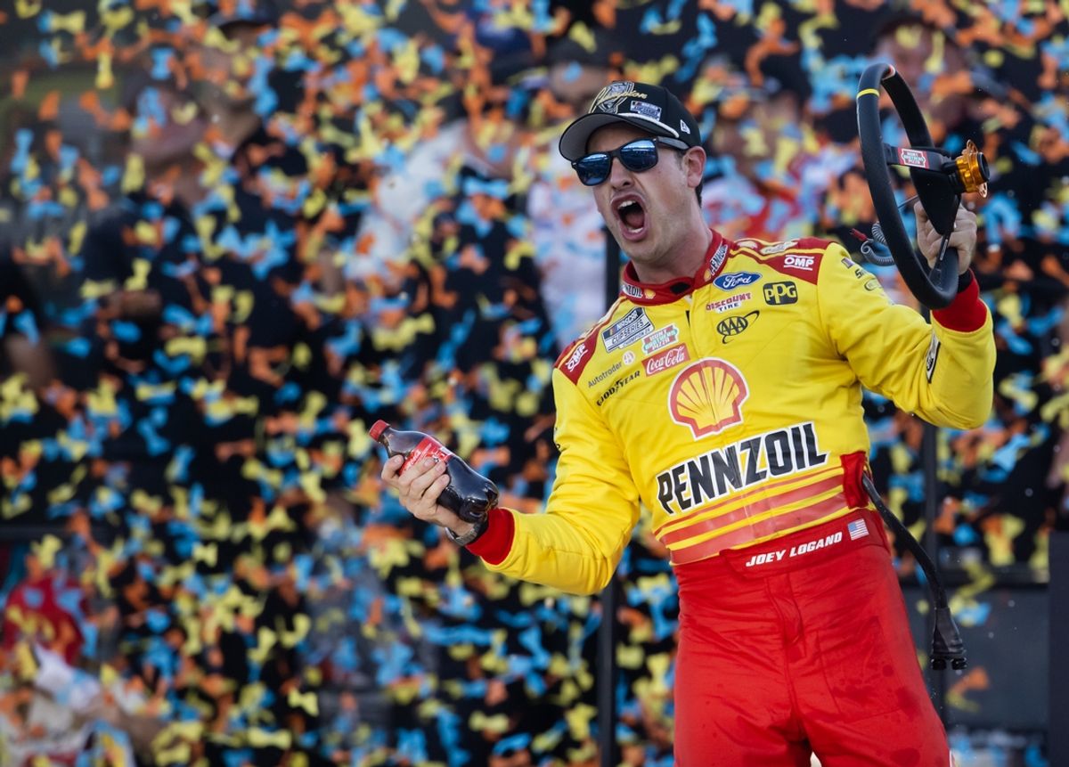 Nov 10, 2024; Avondale, Arizona, USA; NASCAR Cup Series driver Joey Logano (22) celebrates after winning the 2024 NASCAR Cup Series championship and the NASCAR Cup Series Championship race at Phoenix Raceway. Mandatory Credit: Mark J. Rebilas-Imagn Images