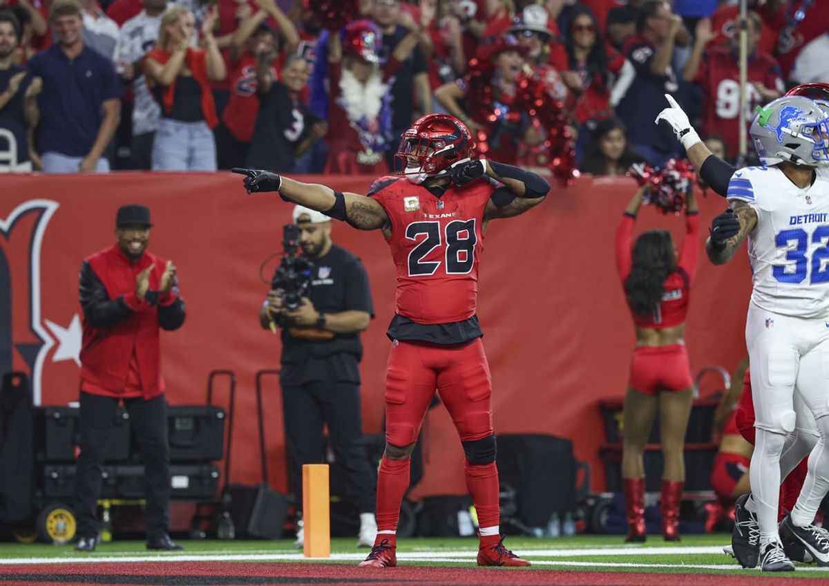 Nov 10, 2024; Houston, Texas, USA; Houston Texans running back Joe Mixon (28) signals after rushing for a first down during the first quarter against the Detroit Lions at NRG Stadium. Mandatory Credit: Troy Taormina-Imagn Images