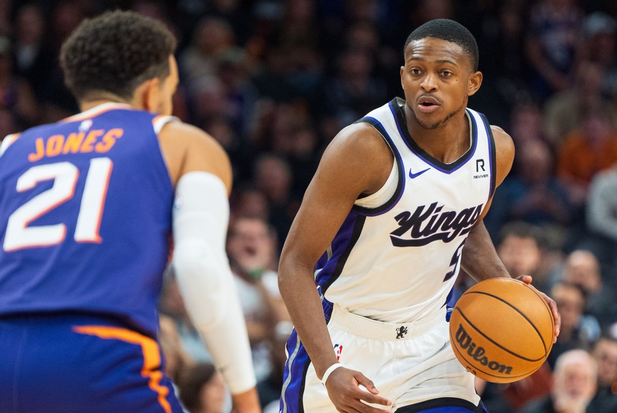 Nov 10, 2024; Phoenix, Arizona, USA; Sacramento Kings guard De'Aaron Fox (5) works the ball down court against Phoenix Suns guard Tyus Jones (21) during overtime of a game at Footprint Center. Mandatory Credit: Allan Henry-Imagn Images