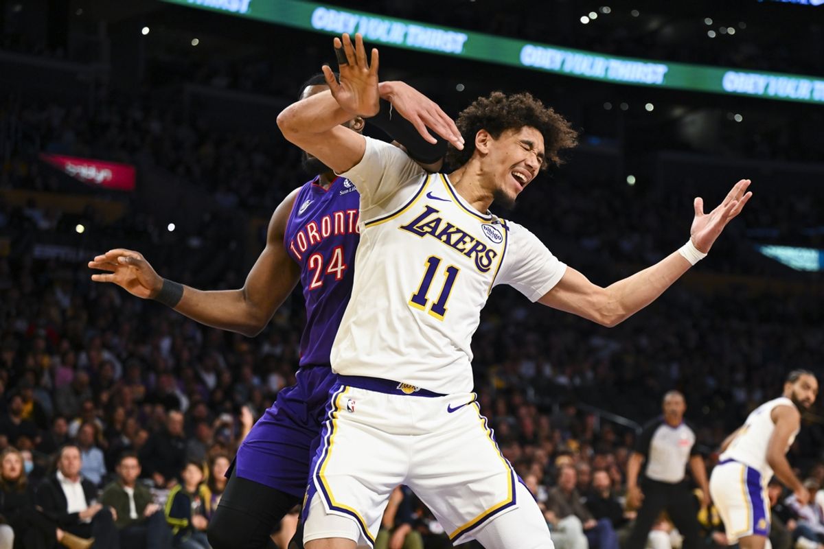 Nov 10, 2024; Los Angeles, California, USA; Los Angeles Lakers center Jaxson Hayes (11) is fouled by Toronto Raptors forward Bruno Fernando (24) during the second half at Crypto.com Arena. Mandatory Credit: Jonathan Hui-Imagn Images