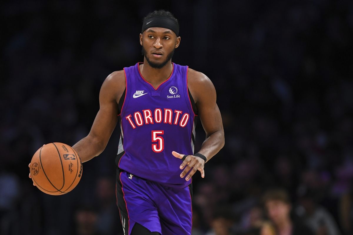 Nov 10, 2024; Los Angeles, California, USA; Toronto Raptors guard Immanuel Quickley (5) dribbles the ball against the Los Angeles Lakers during the second half at Crypto.com Arena. Mandatory Credit: Jonathan Hui-Imagn Images