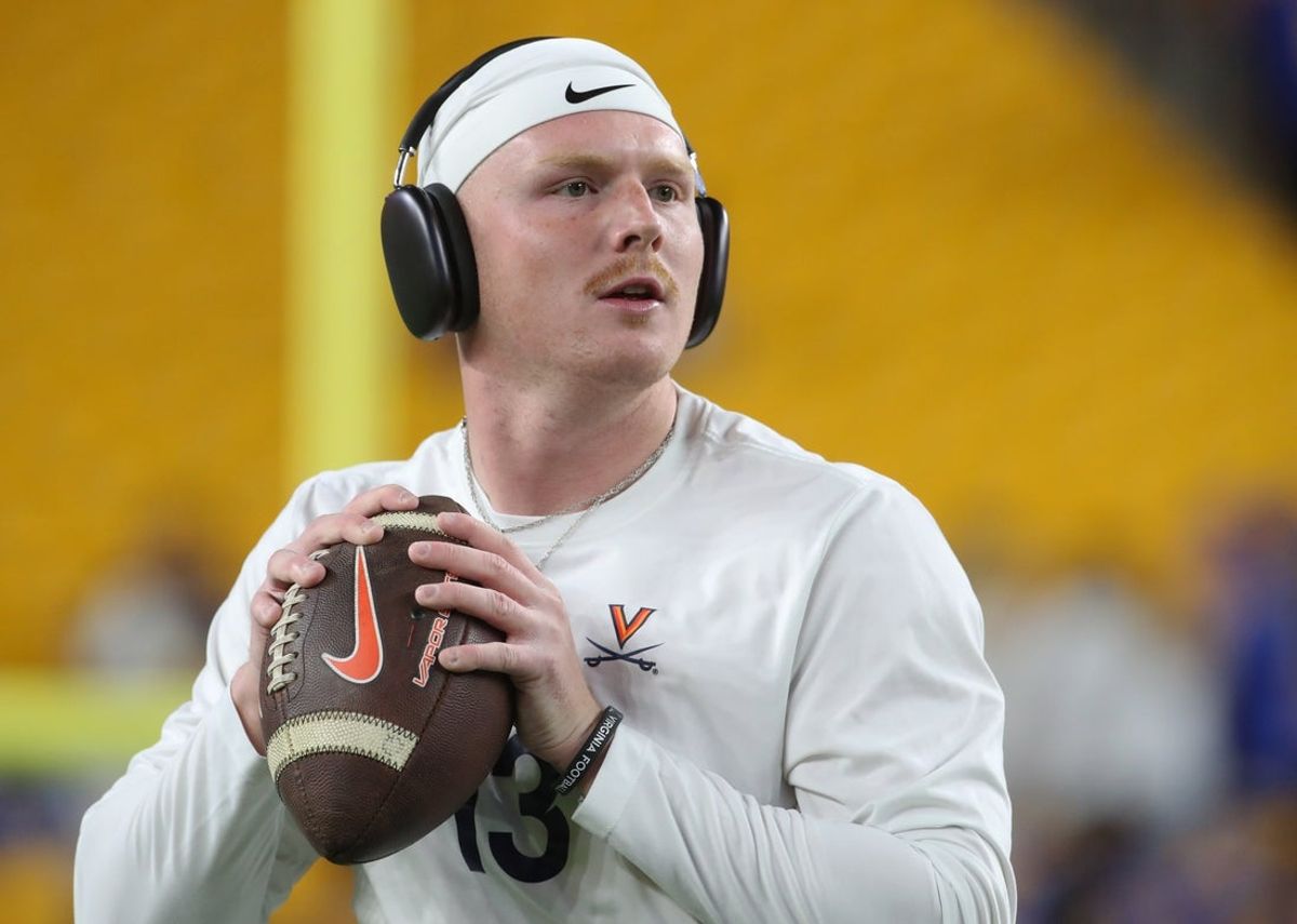 Nov 9, 2024; Pittsburgh, Pennsylvania, USA;  Virginia Cavaliers quarterback Gavin Frakes (13) warms up before a game against the Pittsburgh Panthers at Acrisure Stadium. Mandatory Credit: Charles LeClaire-Imagn Images