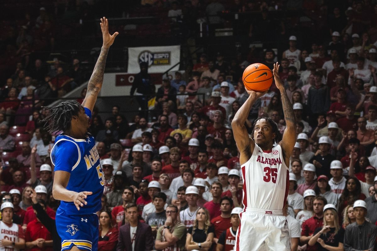 Nov 11, 2024; Tuscaloosa, Alabama, USA; Alabama Crimson Tide forward Derrion Reid (35) attempts a three point basket against McNeese State Cowboys forward Joe Charles (5) during the first half at Coleman Coliseum. Mandatory Credit: Will McLelland-Imagn Images