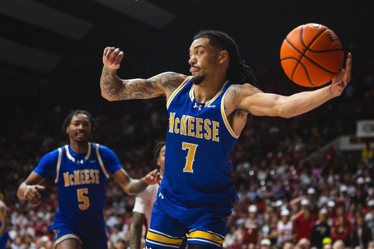 Nov 11, 2024; Tuscaloosa, Alabama, USA; McNeese State Cowboys guard Alyn Breed (7) goes to pass against the Alabama Crimson Tide during the first half at Coleman Coliseum. Mandatory Credit: Will McLelland-Imagn Images