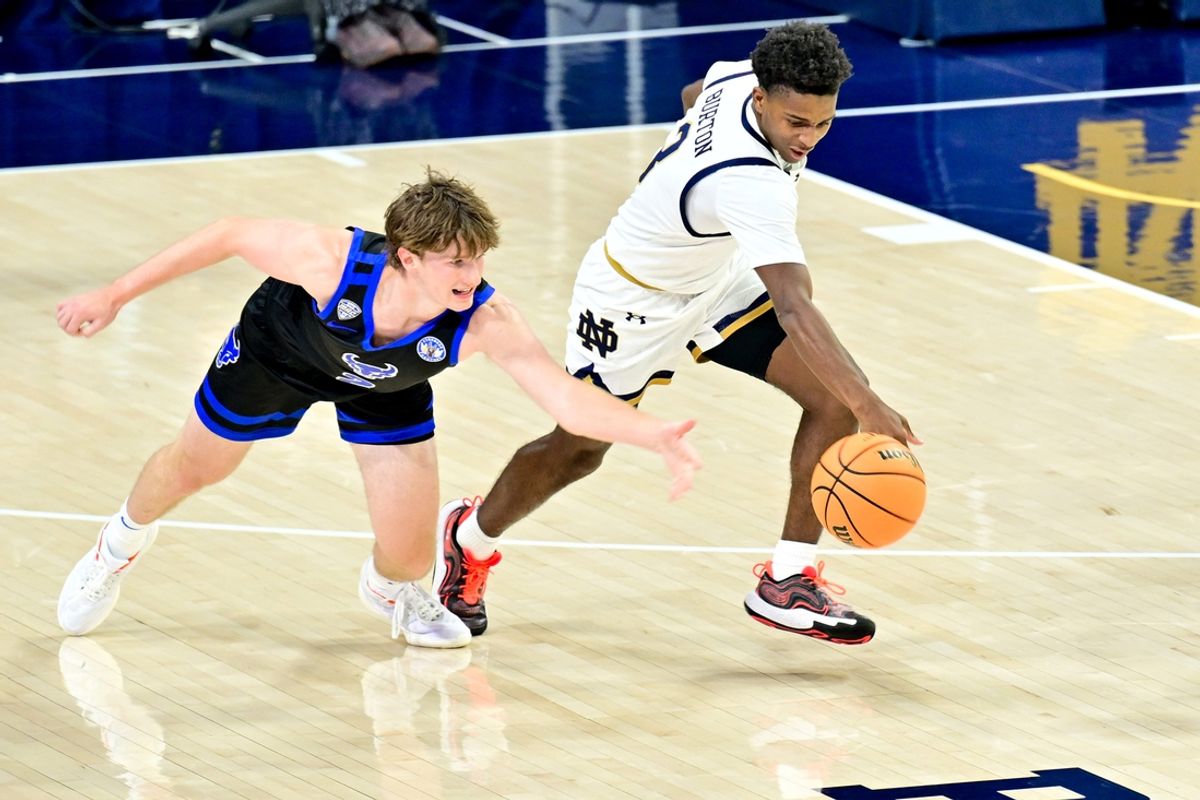 Nov 11, 2024; South Bend, Indiana, USA; Notre Dame Fighting Irish guard Markus Burton (3) steals the ball from Buffalo Bulls guard Ryan Sabol (2) in the first half at the Purcell Pavilion. Mandatory Credit: Matt Cashore-Imagn Images